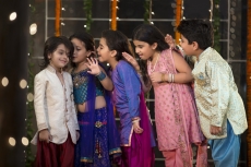 cheerful group of kids whispering in each others ears