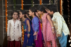 cheerful group of kids whispering in each others ears