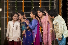 cheerful group of kids whispering in each others ears