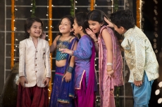 cheerful group of kids whispering in each others ears