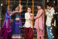 group of kids carrying gifts and presents on diwali