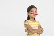 young girl with pencil 