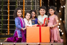 kids offering gift on diwali  