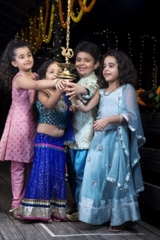 kids lighting diya 