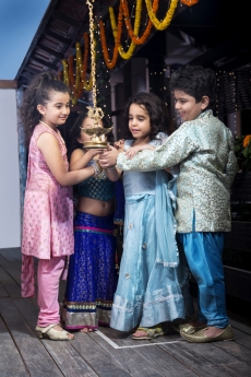 kids lighting diya