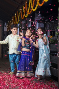 kids playing with rose petals on diwali 