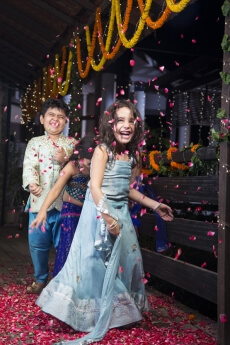 kids playing with rose petals on diwali 