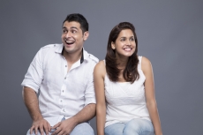 couple sitting in white clothing