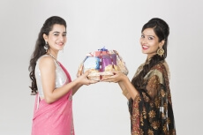 woman in ethnic wear exchanging gift