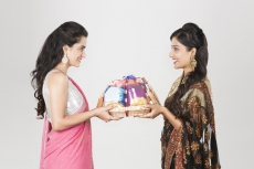 woman in ethnic wear exchanging gift