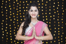 woman in traditional wear with folded hands 