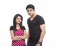 couple posing in casual wear