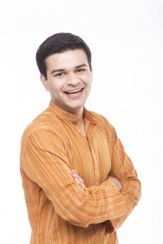 indian man wearing kurta posing for the camera 