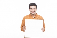 man in kurta holding placard