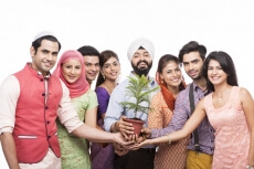 people from all religions posing with a plant 