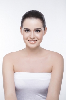 girl with smooth skin smiling and posing