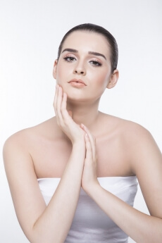 girl with smooth skin posing while looking at the camera