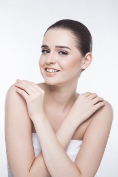 girl flaunting her smooth skin while smiling