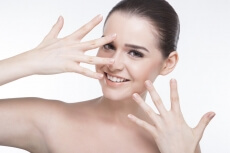 girl with beautiful skin posing and smiling for the camera
