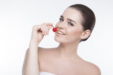 beautiful girl posing with cherry