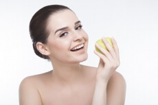 beautiful girl posing with green apple