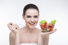 beautiful girl eating salad