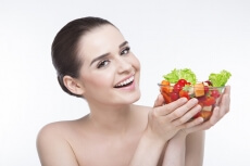 girl posing with salad bowl 