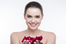 beautiful girl with rose petals 