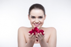 beautiful girl with rose petals 