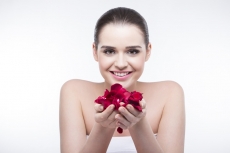 beautiful girl with rose petals 