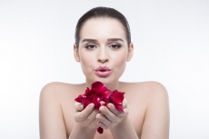 beautiful girl with rose petals 