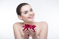 beautiful girl with rose petals 