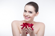 beautiful girl with rose petals 