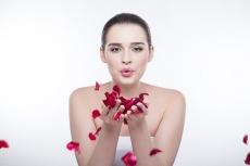 beautiful girl with rose petals 