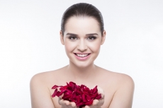 beautiful girl with rose petals 