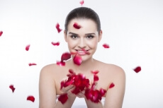 beautiful girl with rose petals 