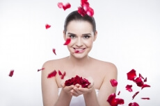 beautiful girl with rose petals 