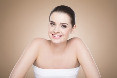 girl with smooth skin posing while looking at the camera