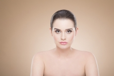 girl with smooth skin posing while looking at the camera
