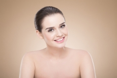 girl with smooth skin posing while looking at the camera