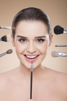 girl smiling during make up process