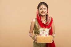 woman posing with gifts