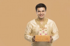 man posing with gifts 