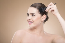 beautiful girl applying hair color
