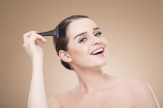 beautiful girl applying hair color