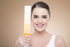 woman with skin shade card