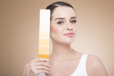 woman with skin shade card