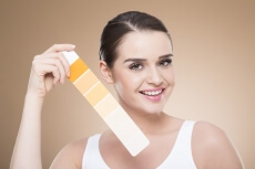 woman with skin shade card