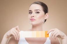 woman with skin shade card