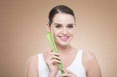girl smiling and posing with aloe vera 